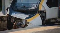 Train with 300 passengers collides with truck on tracks in Brisbane