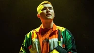 Kneecap rapper charged with terror offence in the UK after 'waving Hezbollah flag'