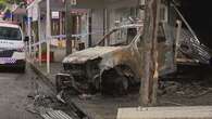 Search for two men after ute slammed into Brisbane shop, set alight