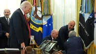 Man collapses behind Donald Trump during White House announcement