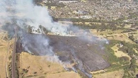 Trains stopped by grass fire in Sydney's south-west