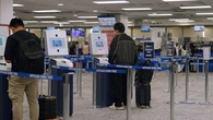 New kiosks cut wait times at Sydney International Airport by 10 per cent