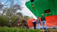 A Norwegian man awoke to find a grounded cargo ship had narrowly missed his home