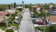 'Coffin' warning as storm surge deep enough to swallow a house nears