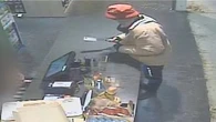 CCTV captures moment man robs store armed with meat cleaver