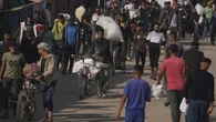 Dozens of Palestinians killed heading to aid hub, officials say