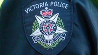 Melbourne academic charged after alleged child sex abuse images appear during lecture