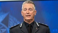 State's top cop apologises for using police helicopter to fly to Tasmania