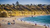 Car drives over cliff onto beach in Adelaide