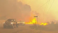 Emergency level bushfires threaten homes, hospital in New South Wales