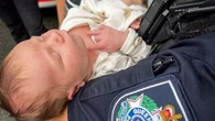 Queensland mum reunites with officers who helped her give birth in carpark