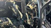 Firefighter injured after hybrid car bursts into flames on Sydney street