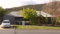 Heavily-armed police swoop on home in their hunt for accused cop killer