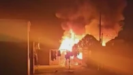 Hero neighbour rescues screaming family from burning caravan