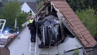 Car crashes into barn roof in Germany, seriously injuring two people