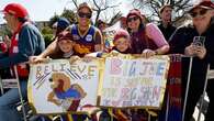 Thousands turn out to watch the AFL Grand Final parade in Melbourne