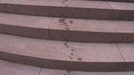 Two men charged after allegedly spraying unknown substance on Anzac Memorial
