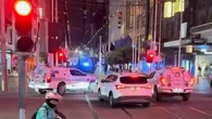 Neo-Nazis march through Melbourne in early hours of the morning