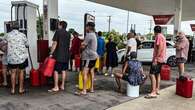 Two dead, one missing, as more rain forecast for inundated North Queensland