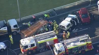 Truck driver trapped, major delays after M1 crash