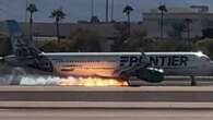 Flames seen under plane as it makes hard landing in Las Vegas