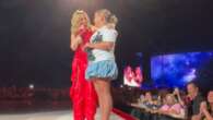 Kylie picks youngster out of the crowd during Perth show