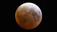 A rare 'blood moon' will light up Aussie skies next week - here's how to see it