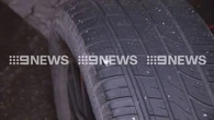 Major highway shut after truck debris shreds tyres of dozens of cars