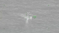 Three men rescued after boat capsizes in waters off Victoria