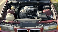 BMW pulled over without bonnet, driver's seat in Melbourne