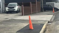 Confusion after New Zealand council asphalts a road cone into the footpath