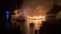 Flames threaten historic former ferry in Sydney Harbour fire