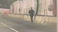 Bizarre vision emerges of man in suit running inside busy Melbourne tunnel