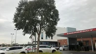 Woman fighting for life after being hit by her own car in hospital carjacking
