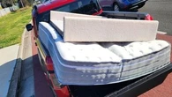 'Nothing wrong with it': Driver baffles police with mattress hanging from ute cab