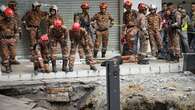 Woman plunges into an eight-metre-deep hole after pavement sinks in Malaysia