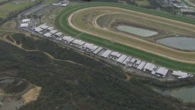 Woman dies at Melbourne racetrack after being kicked by horse