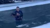 Man's dramatic rescue of dog from freezing river caught on video