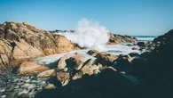 Tourist drowns after being swept off rocks at popular WA beach