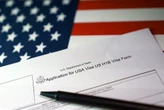 Trump administration sued over pause in immigrant visa processing