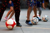 Far from home, migrant children kick off own World Cup in Mexico