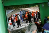 At least 50 bodies recovered after Indonesian school collapse