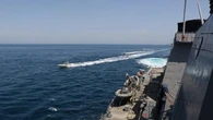 Three vessels hit by projectiles in Strait of Hormuz