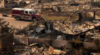 Los Angeles races to contain wildfires before severe winds return