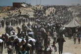 Israel announces daily pauses in Gaza fighting as aid airdrops begin