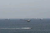 Trump, Iran cite progress in talks as uncertainty hangs over Strait