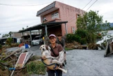 Taiwan’s rescuers search thick mud for missing people after typhoon