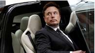 Musk grapples with Tesla share price wobbles and cyberattacks