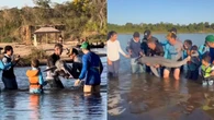 Família fisga boto raro que só existe no Brasil no rio Araguaia