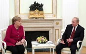 Меркель вимагає від Путіна скоротити військову присутність біля кордонів України